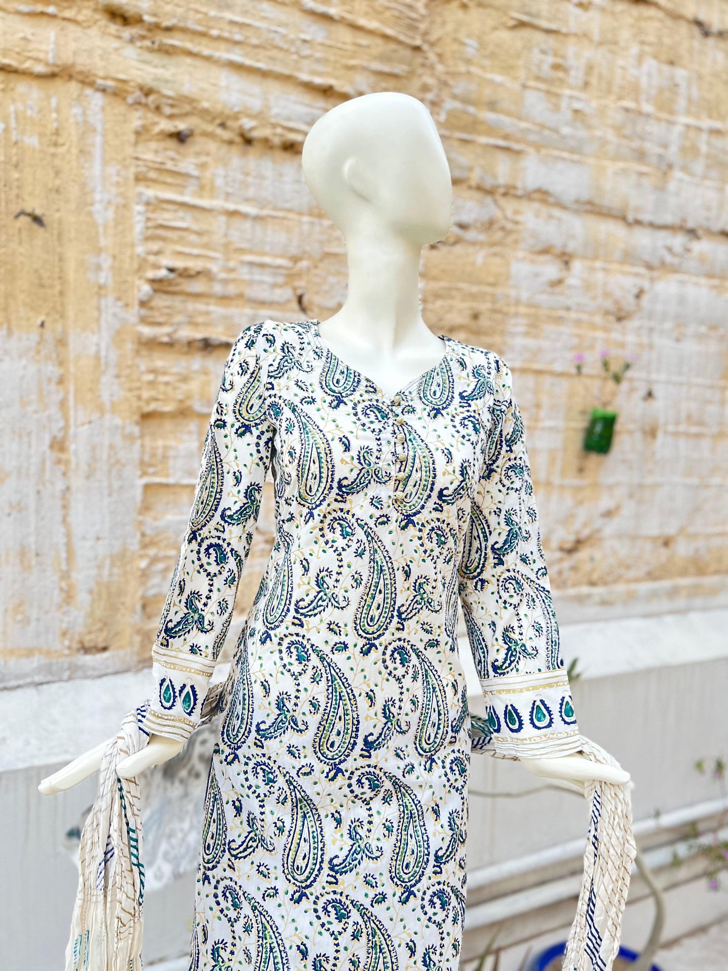This gold and blue paisley design adds an elegant touch to our kora white