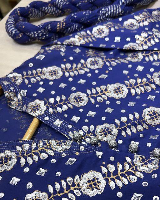 A stunning representation of the art of fashion in this indigo blue with Copper and Silver Block Print. - Stitched Collection