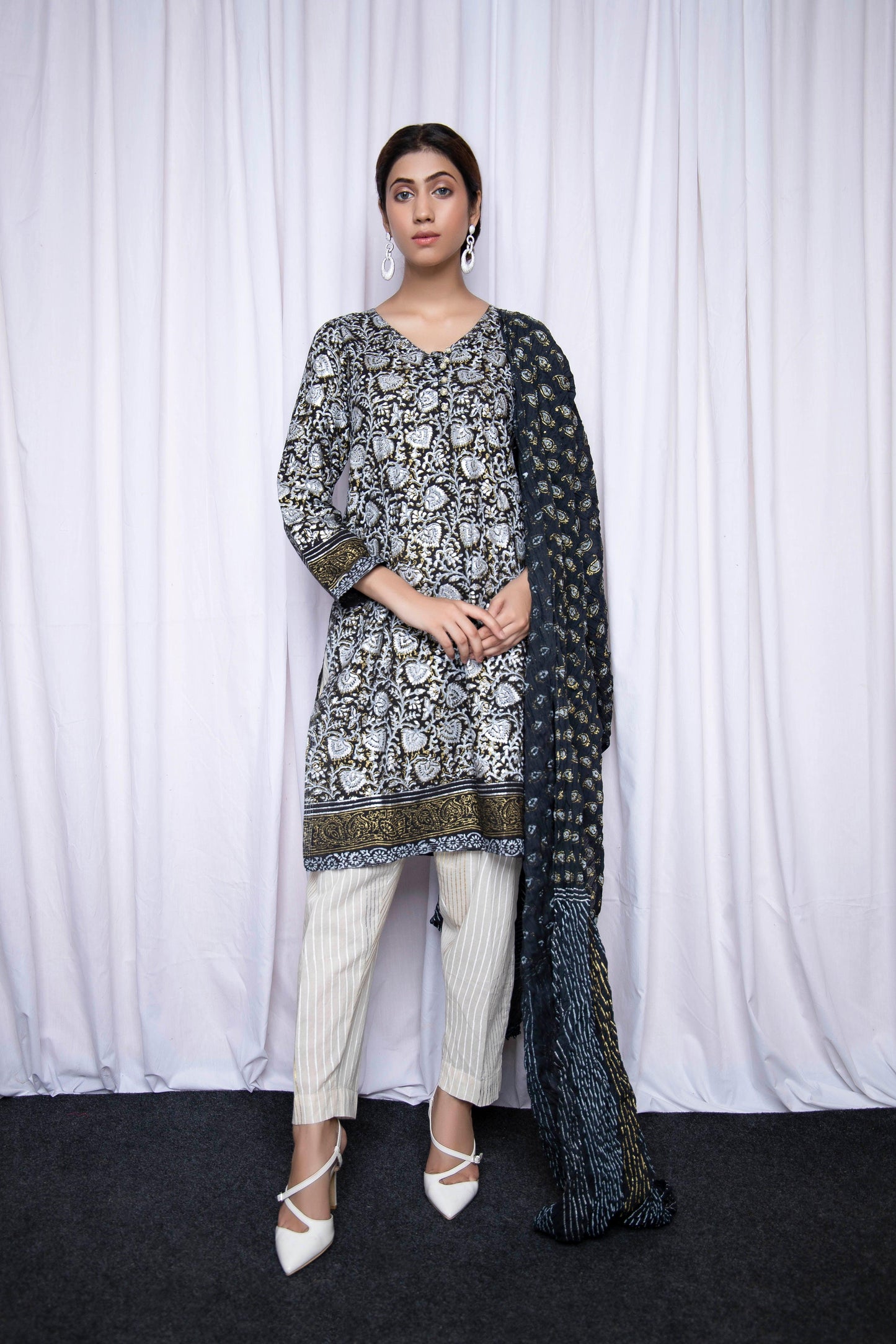 Make an enduring appearance in splendid floral hand block printed with gold and silver - Stitched Collection