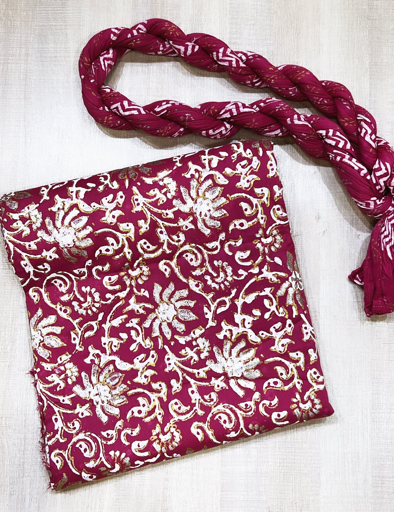The magenta lawn fabric is block-printed with luxurious gold, silver, and white, complemented by a crushed dupatta - Unstitched Collection