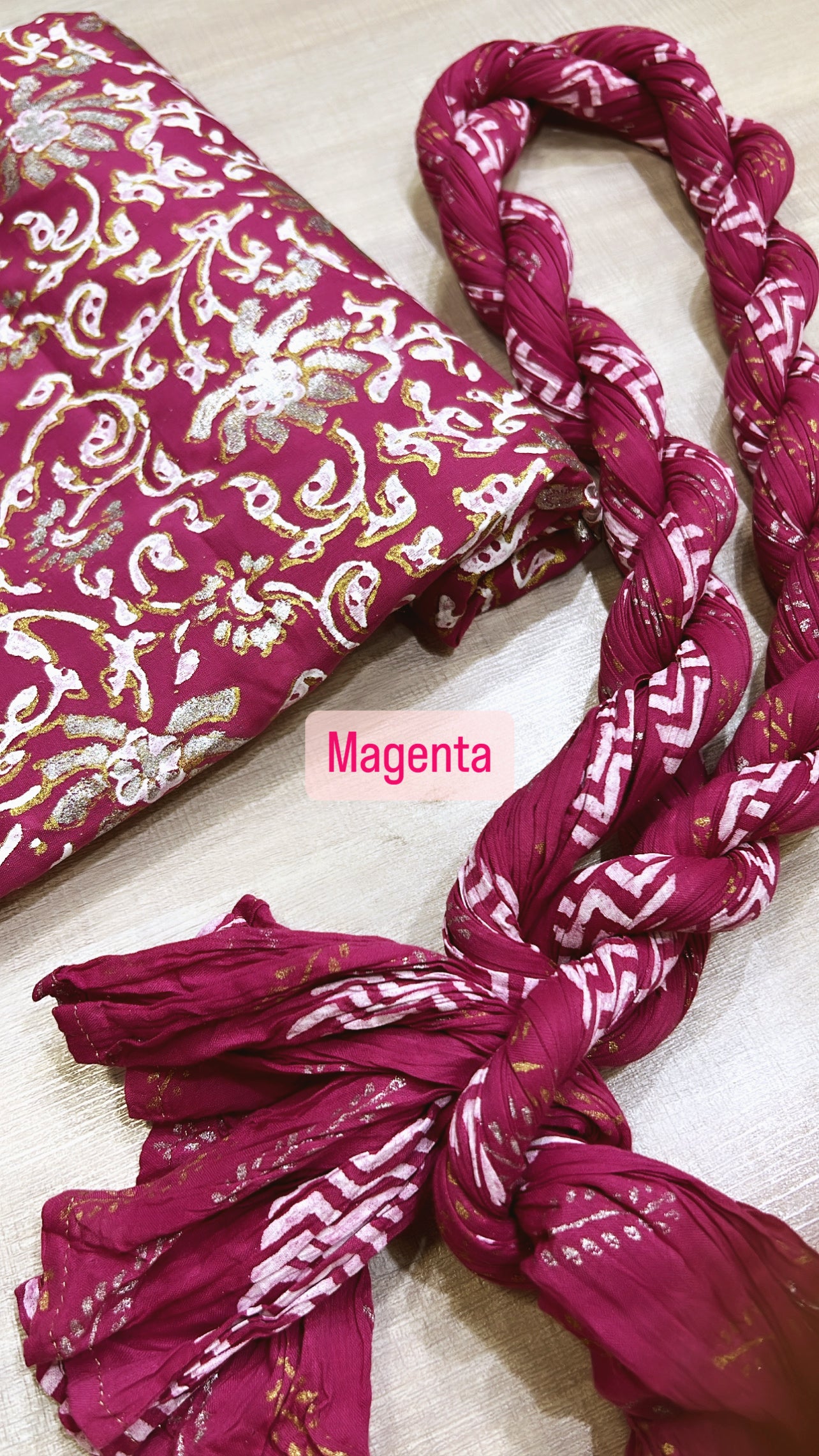 The magenta lawn fabric is block-printed with luxurious gold, silver, and white, complemented by a crushed dupatta - Unstitched Collection