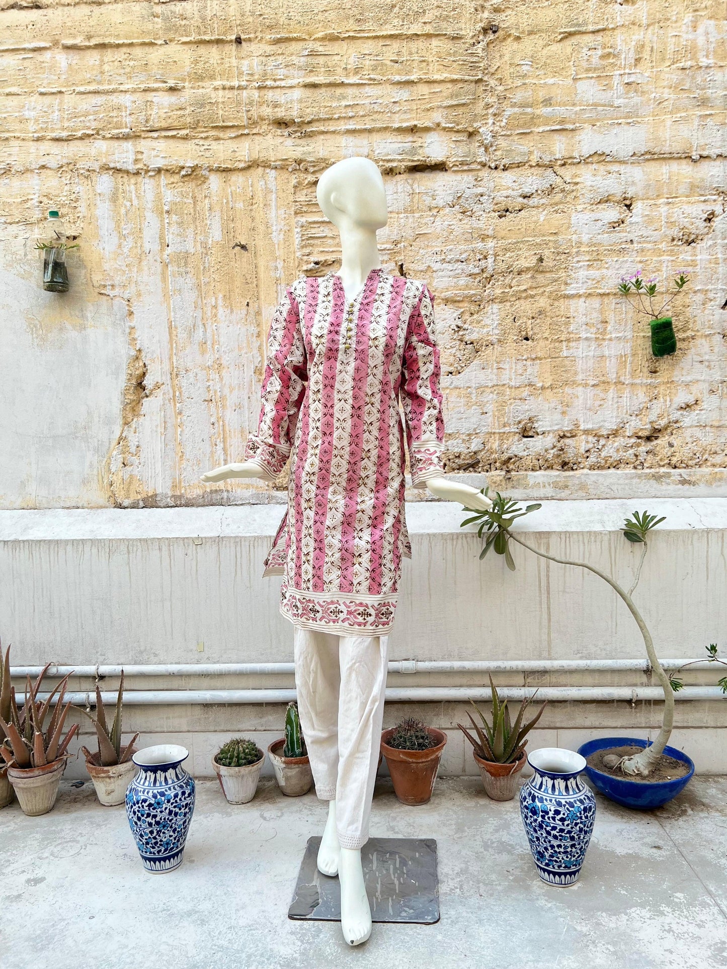 A whimsical take on the orchid's role in the design printed with gold and maroon
