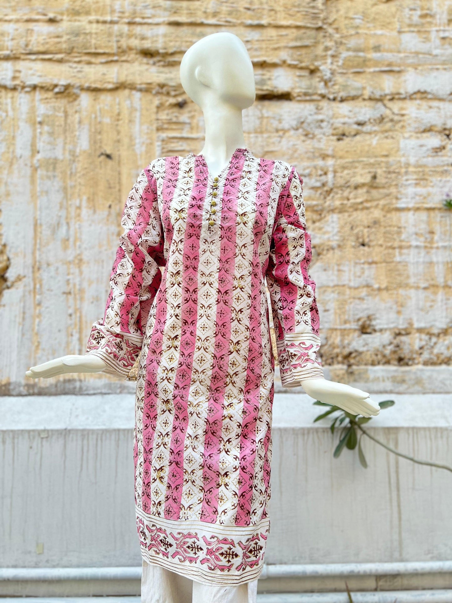 A whimsical take on the orchid's role in the design printed with gold and maroon