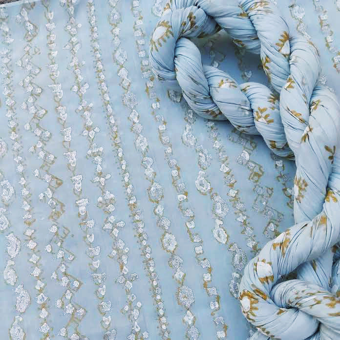 A beautiful matrix design hand block print in gold, silver, and white. - Unstitched Collection
