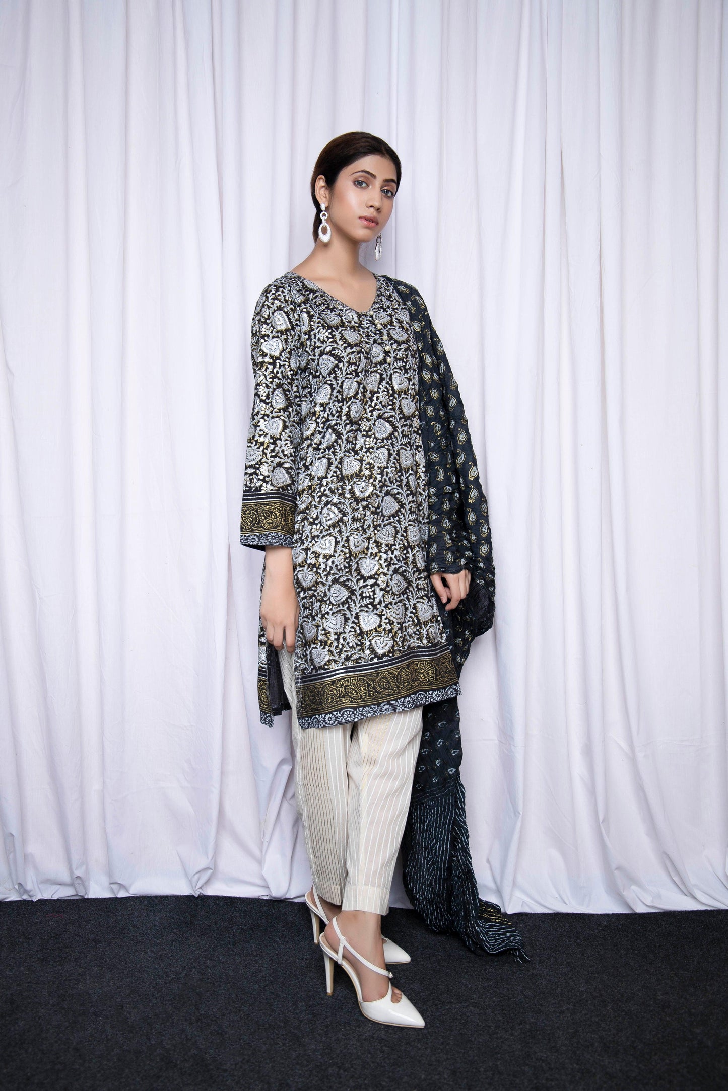 Make an enduring appearance in splendid floral hand block printed with gold and silver - Stitched Collection