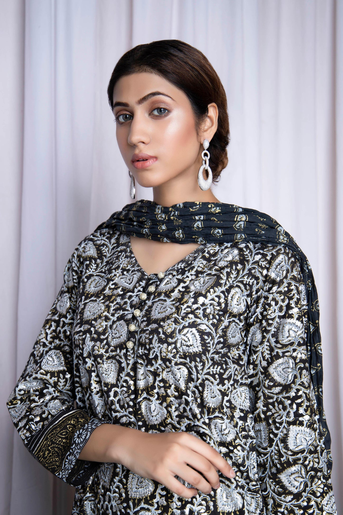 Make an enduring appearance in splendid floral hand block printed with gold and silver - Stitched Collection
